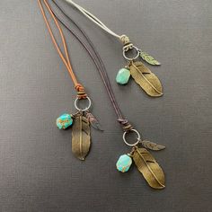 The boho feather Necklace features a custom engraved monogram charm and a turquoise Howlite stone, creating a beautiful bohemian necklace for women. This meaningful Native American jewelry also makes a thoughtful gift for him, blending style and personalization. 🪶 𝗠𝗔𝗧𝗘𝗥𝗜𝗔𝗟𝗦 + 𝗗𝗜𝗠𝗘𝗡𝗦𝗜𝗢𝗡𝗦 ❯  Turquoise Howlite, Silver-plated + Brass Feather, Leather Cording ❯  15mm Engraved Stainless Steel Charm (optional) 🪶 𝗡𝗘𝗖𝗞𝗟𝗔𝗖𝗘 𝗦𝗧𝗬𝗟𝗘-- select from the following styles (see ph Thoughtful Gifts For Him, Monogram Pendant, Boho Feathers, Feather Necklace, Bohemian Necklace, Turquoise Howlite, Feather Necklaces, Necklace Women, Dark Brown Leather