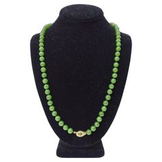 Add a beautiful jade beaded necklace to your jewelry collection! You will be in awe of the beauty of the vibrant green beads. This feature a fully beaded chain with a gold and jade pendant in the center. Pair this beautiful necklace with a Prada blouse, a Bottega Veneta handbag, and some Gucci jewelry to layer. Weight: 59.53 g Length: 12.5 inches Composition: Jade/ 14k Gold Plated on Silver Signed '925' Prada Blouse, Imperial Jade, Bottega Veneta Handbag, Gold Beaded Necklace, Jade Bead Necklace, Vintage Beads Necklace, Gucci Jewelry, Gold Bead Necklace, Green Beads