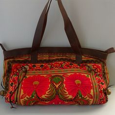 Embroidered Floral Bag With Real Leather Trim. Zipper Closure, Inside Pocket. Bell Accent On Sides. Floral Embroidery Throughout Both Sides. Gorgeous Colors! Brand New 18lx12hx3d Inches Folk Style Embroidered Multicolor Shoulder Bag, Folk Style Multicolor Embroidered Shoulder Bag, Traditional Yellow Shoulder Bag For Daily Use, Travel Shoulder Bag With Multicolor Floral Embroidery, Red Embroidered Bag For Daily Use, Traditional Yellow Bag For Everyday Use, Traditional Yellow Bags For Everyday Use, Folk Style Multicolor Embroidered Rectangular Bag, Yellow Embroidered Tote Bag