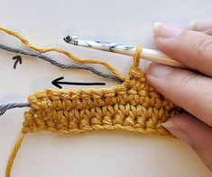 someone is crocheting an object with yarn