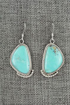 These turquoise and sterling silver earrings were made by Navajo silversmith Verley Betone. The back of the earrings are signed RB and stamped .925.Length: 1 5/8"Width: 5/8"Free shipping on all orders! We ship with USPS and always include tracking. All orders ship within a day of payment.Returns are accepted up to 30 days after you receive your order. Just send us a message. Our shop offers cash back or store credit. The item must be returned in new condition. Bear Carving, White Buffalo, Pearl Chain, Native American Jewelry, Turquoise Sterling Silver, Free Jewelry, White Vintage, Sterling Silver Earrings, Silver Earrings