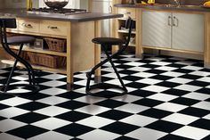 a black and white checkered floor in a kitchen