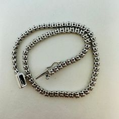 18K White Gold Tennis 6.5" Bracelet with 81 Diamonds (1.0ct) (includes appraisal, Value: $3,600) Designer = Jewelry Material = 18K Gold Gemstone = Diamond Condition = New Location: Wilmette Item Number: 21800-3 Item ID: 299848 Category: Bracelet Fine Jewelry Silver Tennis Bracelet For Everyday Luxury, Fine Jewelry Round Box Chain Bracelets, Classic White Gold Diamond Bracelet With Box Chain, Platinum Tennis Bracelet With 17 Jewels As Gift, White Gold Diamond Bracelets With Box Chain, White Gold Tennis Bracelet With Box Chain As Gift, Luxury Sterling Silver Bracelet With Single Cut Diamonds, Diamond Bracelet With Box Chain As Gift, Elegant Formal Tennis Bracelet With Box Chain