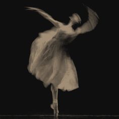 a black and white photo of a ballerina