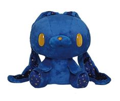 a blue stuffed animal with gold eyes