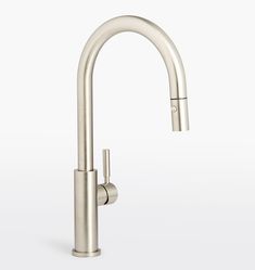 a stainless steel kitchen faucet with an angled spout and pull out sprayer