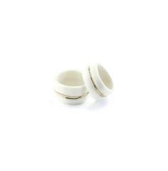 two white ceramic rings on a white background