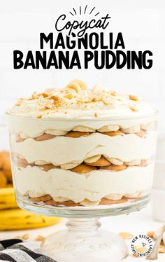 a close up of a banana pudding in a glass dish on a table with bananas