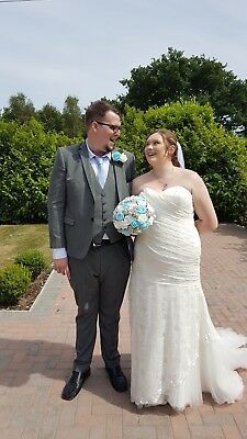 a bride and groom are posing for the camera