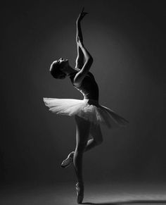 a black and white photo of a ballerina