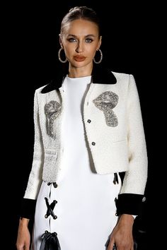 Diamond Bow Jacket combines the allure of diamonds with a stylish bow detail, resulting in a sophisticated and elegant jacket suitable for various formal or upscale events. Handmade customization Fabric composition: 90% polyester fiber, 10% spandex Washing method: hand wash or dry clean Popular elements: rhinestones Luxury Embellished Outerwear For Work, Luxury Embellished Workwear Outerwear, Elegant Long Sleeve Embellished Blazer, Chic Embellished Formal Outerwear, Elegant White Blazer For Night Out, White Tuxedo-style Party Outerwear, Tailored Embellished Elegant Outerwear, Glamorous Tailored Long Sleeve Outerwear, White Tuxedo Style Party Outerwear