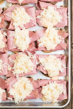 ham and cheese on toasted bread in a baking pan