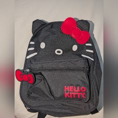 This Is A Hello Kitty Mini Nylon Backpack In The Color Black. Brand New With Tags But Some Color Fading From The Red Hello Kitty Logo On The Front. Comes From A Smoke-Free Home. Measures Approximately 10" X 8.5" X 3.5" Hello Kitty Logo, Red Hello Kitty, Hello Kitty Backpack, Kitty Backpack, The Color Black, Red Backpack, Black Backpack, Things To Buy, Black Color