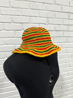 Made to order crochet bucket hat in Jamaican Rasta Colors. Perfect for gifting or vacations! One size, unisex adult hat sizing Vacation Hat With Short Brim And Knitted Details, One Size Crochet Hat For Vacation, Knitted Bucket Hat For Vacation, Knitted Hat With Curved Brim For Vacation, Yellow Knitted Beach Hat, Knitted Hats For Vacation, One Size Fits Most, Yellow Crochet Hat For The Beach, Knitted Adjustable Bucket Hat For Vacation, Adjustable Knitted Bucket Hat For Vacation