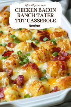 chicken bacon ranch tater tot casserole in a white dish with green onions