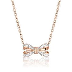 Dainty but far from boring. A charming piece of fine jewelry that can be passed down for generations, this 10K Rose Gold Snow White Bow Necklace will certainly be treasured. Inspired by a Disney princess' iconic hair bow, here is a graceful necklace decorated with 1/10 cttw diamonds. This is an accessory that will look beautiful on its own or layered together with other neat and sweet necklaces. Iconic Hair, Minimal Pendant, Enchanted Disney, Enchanted Disney Fine Jewelry, Disney Fine Jewelry, Pearl Jewels, Jewelry Design Drawing, Sweet Necklace, Diamond Bows