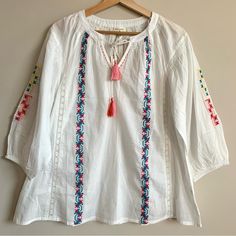 World Market Boho White Top Nwt Loose Fit Embroidered Tassel Front String Tie Adorable White Cotton Top With Back Tassel Tie-up, White Cotton Top With Tassels, White Casual Top With Tassel Ties, White Casual Tops With Tassel Ties, Casual White Tops With Tassel Ties, Spring Cotton Embroidered Top With Tassels, White Tops With Tassel Ties For Vacation, White Tassel Tie Top For Vacation, Spring Folk Style Tops With Tassels