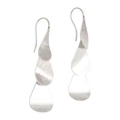 The shimmer of cascading raindrops comes to mind in these sterling silver dangle earrings from Bali's Candradewi. The droplets on top are affixed to silver ear wires while the two below dangle gracefully. The earrings feature a high-polish lightly hammered finish that adds to the allure. Contemporary Silver Drop Earrings, Contemporary Silver Drop Jewelry, Modern Silver Teardrop Linear Earrings, Silver Long Drop Linear Earrings, Modern Sterling Silver Drop Linear Earrings, Modern Silver Drop Earring Set, Nickel-free Dangle Drop Earrings, Silver Drop Chandelier Earrings, Modern Sterling Silver Teardrop Dangle Earrings