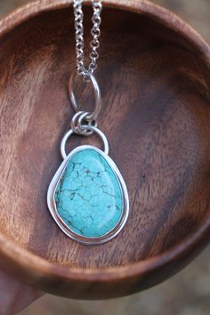 The most striking, one of a kind necklace featuring a natural turquoise cab surrounded by chunky sterling silver - what more could a boho babe ask for!? -d e t a i l s- -hand crafted & bezel set in solid sterling silver, this irregular turquoise cabochon measures 3 x 2.3 cm -the entire pendant incl. silver rings measures roughly 6cm top to bottom -includes a chunky 45cm sterling silver chain  Ready to ship! >All Lola&Cash jewellery will arrive gift wrapped >>Rush orders can be accommodated - ple Handmade Turquoise Necklace With Oval Sterling Silver Pendant, Handmade Sterling Silver Turquoise Necklace With Oval Pendant, Handmade Sterling Silver Turquoise Teardrop Pendant Necklace, Handmade Turquoise Teardrop Pendant Necklace In Sterling Silver, Handmade Teardrop Turquoise Necklace In Sterling Silver, Handmade Turquoise Teardrop Pendant In Sterling Silver, Bohemian Turquoise Necklace With Large Sterling Silver Stone, Bohemian Turquoise Necklace With Large Teardrop Stone, Bohemian Turquoise Teardrop Necklace With Large Stone