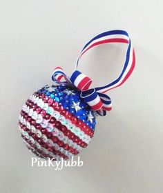 a red, white and blue ornament hanging on a wall