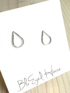 Gorgeous, handcrafted, hammered teardrop stud earrings in Sterling Silver. Dainty, minimalist and perfect for everyday wear! Teardrops measure 1/2" and are set atop Sterling Silver stud posts and include matching ear nuts. 100% hypoallergenic, waterproof and tarnish resistant. Handmade in the USA. All of our jewelry items arrive wrapped, perfect for gift giving! Silk Bag, Detail Shop, Hammered Silver, Sterling Silver Studs, Silver Earrings Studs, Silver Studs, Post Earrings, Nuts, Metallic Silver