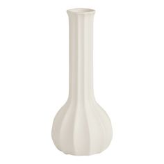 a white vase sitting on top of a table