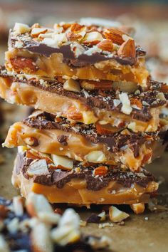 three pieces of chocolate and nuts bar stacked on top of each other