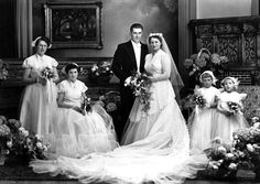 an old black and white photo of people in wedding dresses