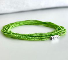 Mindfulness and sophisticated style meld together flawlessly in this wrap bracelet designed to help you set your personal intention as you wrap the bracelet on your wrist. From MaeMarie Wraps. Adjustable Multi-strand Wrap Bracelet As Gift, Green Multi-strand Wrap Bracelet As Gift, Adjustable Multi-strand Bracelets For Summer, Summer Multi-strand Bracelets As A Gift, Summer Multi-strand Bracelets As Gifts, Multi-strand Bracelets For Summer Gifts, Summer Gift Multi-strand Bracelets, Hand Wrapped Multi-strand Wrap Bracelet As Gift, Summer Gift Wrap Bracelet With Round Beads