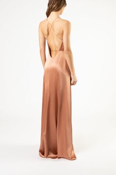 Full length wrap gown in pure silk satin. Features a low neckline, open back, and thin straps that tie at waist. Fully lined in silk. Imported.   Composition: 100% silk Nude Silk Dress, Nude Dress, Low Neckline, Silk Gown, Silk Satin, Pure Silk, Silk Dress, Open Back, Formal Dresses Long