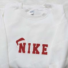 Santa Hat Christmas Embroidered Shirt Embroidered Cotton Christmas Sweatshirt, Christmas Cotton Sweatshirt With Embroidered Logo, Embroidered Long Sleeve Christmas Sweatshirt, Casual Winter Sweatshirt With Machine Embroidery, White Fleece Sweatshirt With Embroidered Text, Holiday Embroidered Tops As Gift, White Fleece Top With Embroidered Graphics, White Letter Embroidery Sweater For Winter, White Embroidered Sweatshirt For Winter