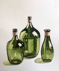 three green glass bottles sitting next to each other