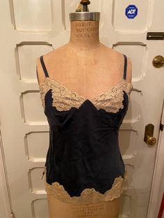 Beautiful buttery silk navy blue and lace tank top. Perfect condition, just gorgeous. Measurements: Size: s  Bust: 36" Waist: 31" Length: 22" Blue Lace Fitted Camisole, Blue Fitted Lace Camisole, Fitted Blue Lace Camisole, Sleeveless Silk Lace Top, Blue Spaghetti Strap Tank Top With Lace Trim, Vintage Lace Top Sleeveless Camisole, Vintage Sleeveless Camisole With Lace Top, Blue Lace Trim Camisole With Spaghetti Straps, Blue Lace Trim Spaghetti Strap Camisole