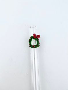 "🎄 This listing is for 1 custom, made to order clear glass drinking straw with a Christmas Wreath design 🎄All Straws are handmade by us in Murrieta, CA USA 🎄 Custom Lengths - choose from 3\" - 13\" lengths  🎄 Custom Widths - Our straws are durable borosilicate glass offered in Thin 8mm, Regular 9.5mm, Smoothie 12mm and Wide (Boba) 15mm outer diameter and 1.8mm - 2.2mm thickness. 🎄 Our Christmas Wreath is green with a red bow if you'd like different colors let us know in Personalization (Chr Boba Straw, Straw Wreath, Smoothie Straw, Reusable Straws, Drinking Straw, Modern Accessories, Glass Straws, Wreath Designs, Reusable Straw