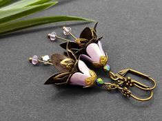 Purple flower earrings, Bell flower dangle, Earrings flower, Purple bell dangle, Wife gift, Women earrings, Flower dangle, Statement earrings, Girlfriend gift, Nature earrings, Flower team jewelry, Pink color hand painted bell flower earring with antique bronze and brass metal details and multicolor Czech crystals 4mm, Austrian crystals Earrings total length 2 1/2 Inches ( 6,3cm) The hand-painted shade of mint is covered with lacquer, which guarantees a long service life and gives the earring el Vintage Flower Charm Dangle Earrings, Handmade Elegant Flower Pendant Earrings, Vintage Dangle Earrings With Flower Charm, Drop Earrings With Flower Charm, Unique Flower Charm Dangle Earrings, Dangle Earrings With Flower Decoration For Gift, Unique Dangle Flower Charm Earrings, Vintage Dangle Flower Earrings For Gift, Adjustable Flower Decorated Earrings For Gifts