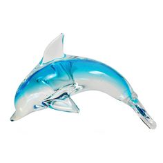 a glass dolphin figurine on a white background