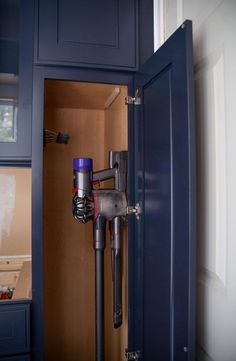 a close up of a vacuum in a cabinet