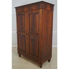 an old wooden armoire with two doors