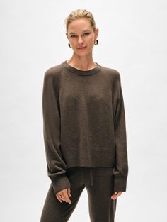 The sweatshirt you know and love returns, and now with more modern appeal. Updated with a cropped length, this relaxed-fitting style is crafted from our classic cashmere weight with sporty raglan sleeves and ribbed trims. Pair it with the matching jogger for a luxe loungewear look, or wear it with jeans for days on the go. Details Relaxed fit. Long sleeve. Length in size small is 21". The model is 5'8" and is wearing a size small. 100% Cashmere. Hand wash cold or dry clean. Do not twist or wring Luxe Loungewear, Pajamas Gift, Sweater Tank Top, Workout Sweatshirt, Active Wear Tops, Pullover Sweatshirts, Raglan Sleeve, Bottoms Pants, Outerwear Jackets