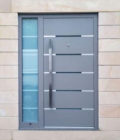 a modern door with glass and metal bars