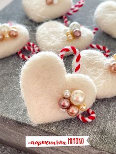 some white heart shaped ornaments with candy canes