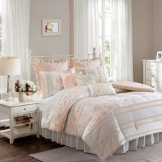 Transform your cozy retreat with the enchanting set. Revel in the beauty of a 180-thread-count cotton fabric adorned with a delicate floral print in peach and grey, harmonized with grey and white polka dots. The reverse side introduces versatility with a solid light peach. Each pattern is enhanced by a ruffle detail, infusing a feminine flair, while additional ruffle details on the edges contribute to extra elegance. The set is accompanied by three decorative pillows and two Euro shams (1 Euro s Coral Comforter, Cotton Comforter Set, Home Essence, Coverlet Bedding, Comforter Bedding Sets, Cotton Comforters, Madison Park, Coverlet Set, King Comforter