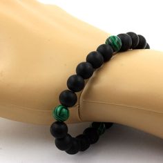 8mm Matte Black Onyx + Malachite (unnatural) Beaded Bracelet. Length 19-20 cm. Bracelet length of your choice on request. Made in France in the A Bijoux workshop Delivered in a box pouch. Ref. : SKU049236 Black Stretch Bracelet With Natural Stones For Healing, Healing Black Stretch Bracelet With Natural Stones, Black Natural Stones Stretch Bracelet For Healing, Malachite 8mm Beads Jewelry Gift, Green Onyx Bracelets - Gift, Green Malachite Gemstone Bead Jewelry, Hand-strung Malachite Bracelets For Gifts, Bracelet Pierre Malachite, Black Onyx