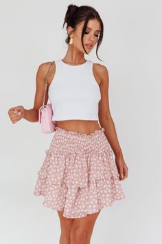 Pink mini skirt Elasticated waist Fully lined Layered ruffles Get ready to fall in love with our super cute Sylvie mini skirt. We are obsessed with that feminine print and layered, ruffle hem! Perfect for Sunday Brunch or happy hour with your girls. Team it with a simple white crop top and mules for an adorable look. MODEL INFO Model is wearing size XS Height: 5'2" Bust: 33.5" Waist: 25" Hips: 35" CARE Hand Wash Cold. Do Not Iron. MATERIAL POLYESTER Pink Dress Shoes, Mini Skirt Pink, Layered Mini Skirt, Brunch Dress, Yellow Bridesmaids, Pink Mini Skirt, Blue Bridesmaids, Clothing Tags, Date Night Dresses