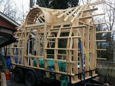 a truck with wooden framing on the back