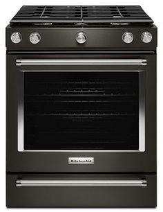 a black oven with the door open and two burners on it's side