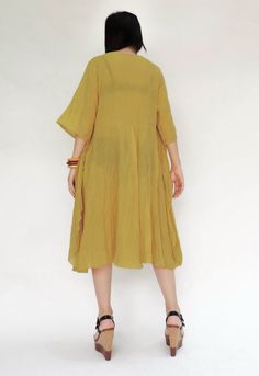 "🚚..ALL ORDERS ARE SHIPPED VIA DHL EXPRESS MAIL An easy flatter floral appliqué tunic dress with round neck, short sleeves, side seam pockets. The front piece is sewn to the neck line and shoulder then let it hanging down to the side seam, look like a wing. This will create aflutter while you are moving. Terrific with long skirts, pants, leggings or alone as a flirty summer dress. NOTE: You may want to wear inner-wear when wearing this soft cotton tunic dress. As it can see through when you are Oversized Spring Tunic, Spring Bohemian Solid Color Dress, Solid Color Spring Bohemian Dress, Bohemian Solid Color Spring Dresses, Solid Color Bohemian Spring Dress, Summer Daywear Shift Dresses, Flowy Casual Spring Tunic, Summer Shift Dress For Daywear, Casual Flowy Tunic For Spring