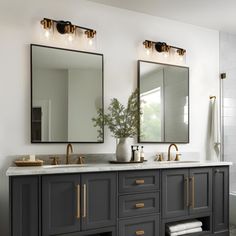 a bathroom with two sinks, mirrors and a bathtub in the middle of it