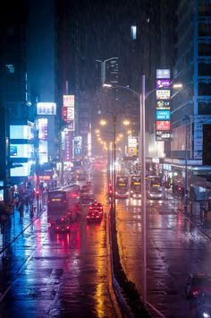 city street at night in the rain with traffic