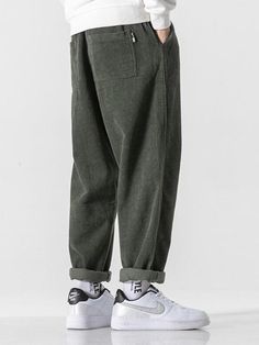 Add a cozy touch to your Soft Boy aesthetic with these Corduroy Jogger Pants. Crafted from premium cotton, the pants offer unbeatable comfort and style. The elasticated waist with a tie and ankle cuffs ensure a snug fit, while the cuffed hem adds a stylish twist. Featuring twin front pockets for added convenience, these joggers will quickly become your go-to choice for laid-back looks. Soft boy aesthetic Men's pants Elasticated ankle cuffs Elasticated waist with tie Cuffed hem Twin front pockets Cotton Corduroy material Casual Corduroy Pants With Elastic Waistband, Winter Cotton Cargo Pants With Relaxed Fit, Baggy Corduroy Cargo Pants, Casual Solid Corduroy Pants, Casual Solid Color Corduroy Pants, Casual Green Corduroy Pants, Casual Khaki Corduroy Bottoms, Baggy Corduroy Bottoms With Side Pockets, Relaxed Fit Corduroy Ankle-length Pants